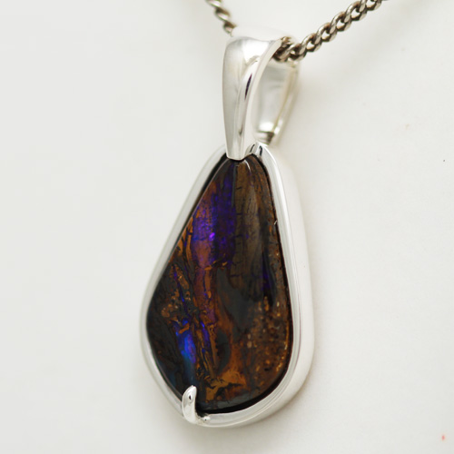 Stirling silver Pendant with SOLID BOULDER OPAL Purple fire amonst the mother stone